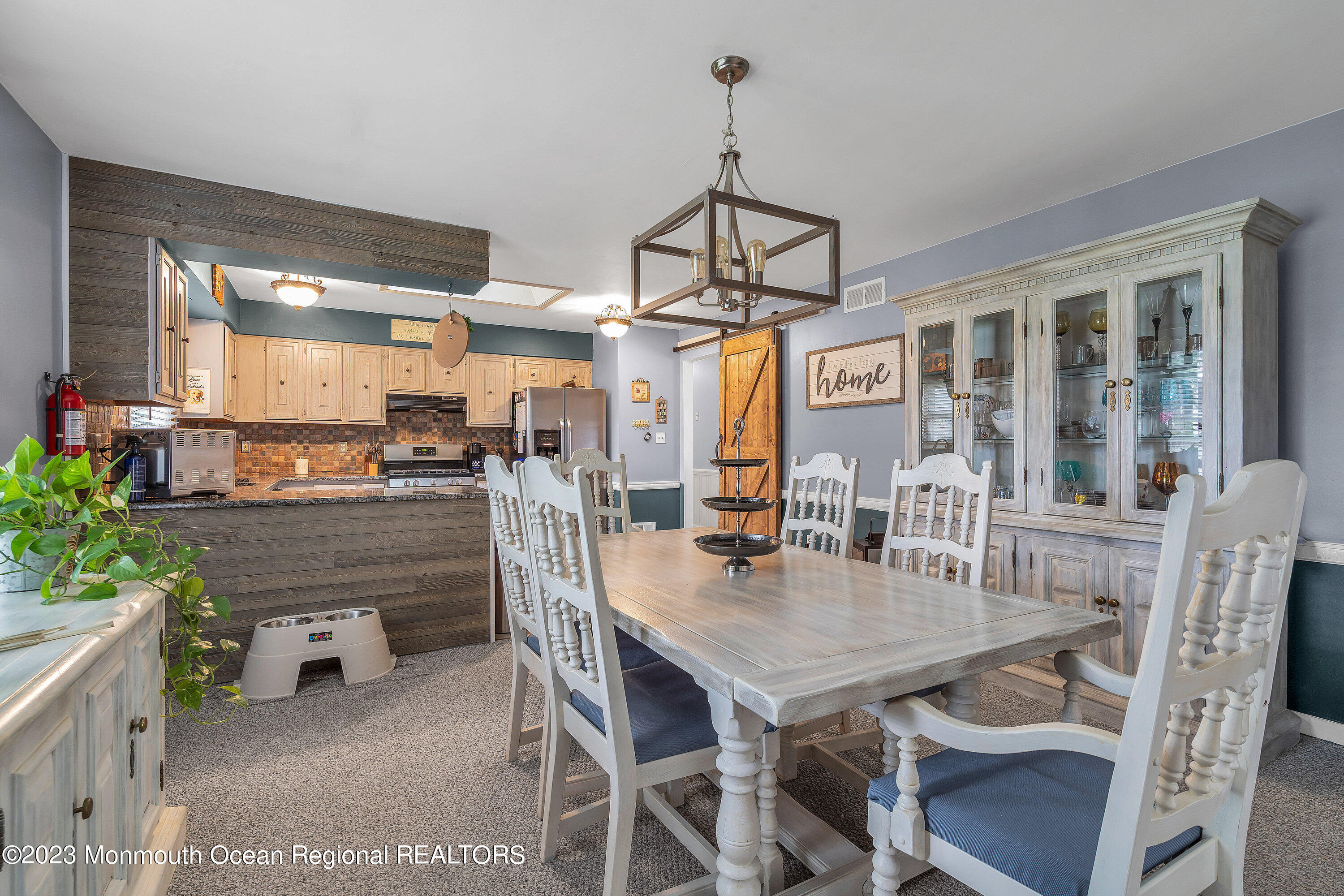 20 Woodland Road Bayville, NJ 08721 - Photo 23 of 62 a dining room with furniture a chandelier and window