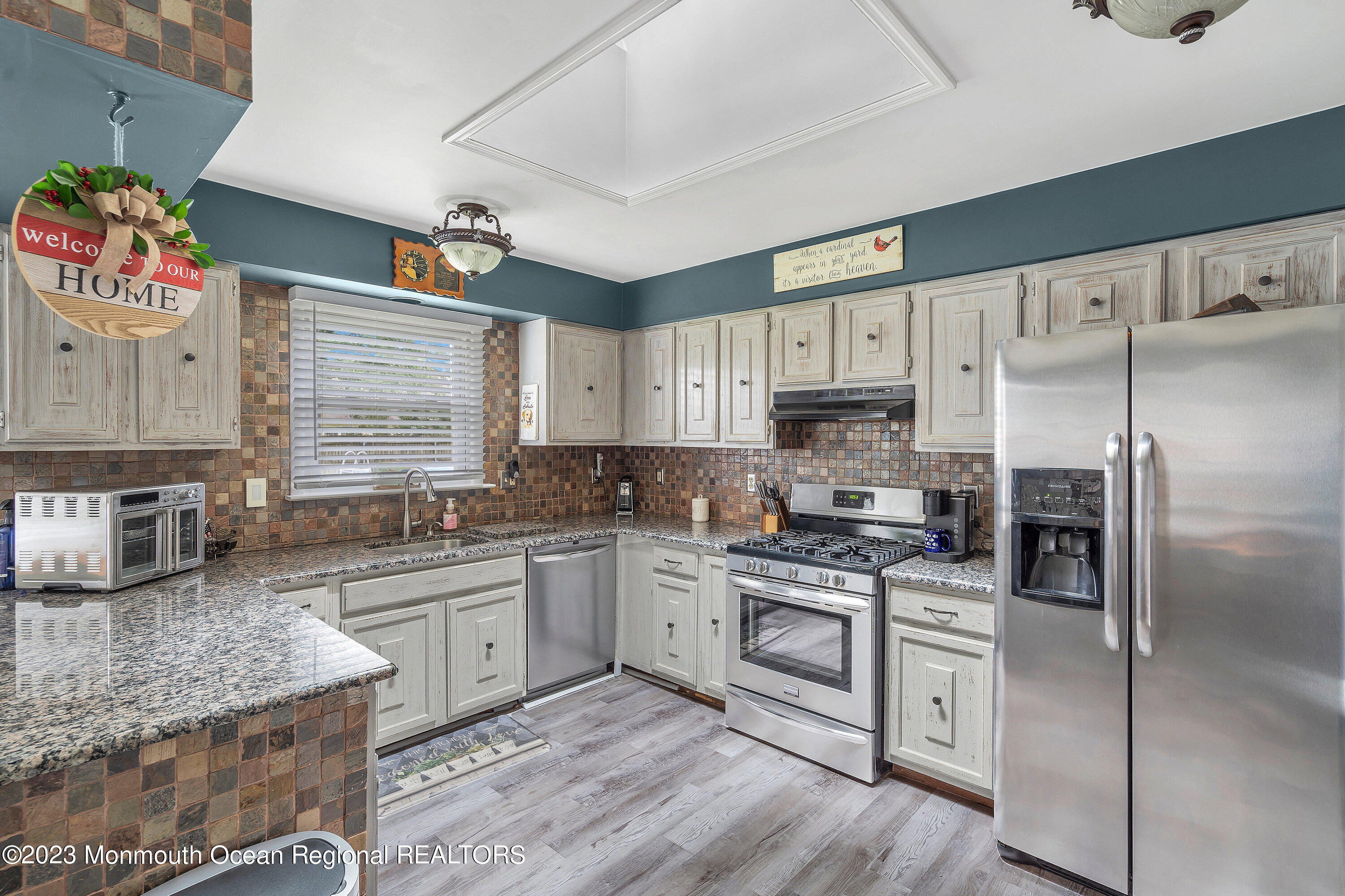 20 Woodland Road Bayville, NJ 08721 - Photo 28 of 62 a kitchen with a sink stove and refrigerator