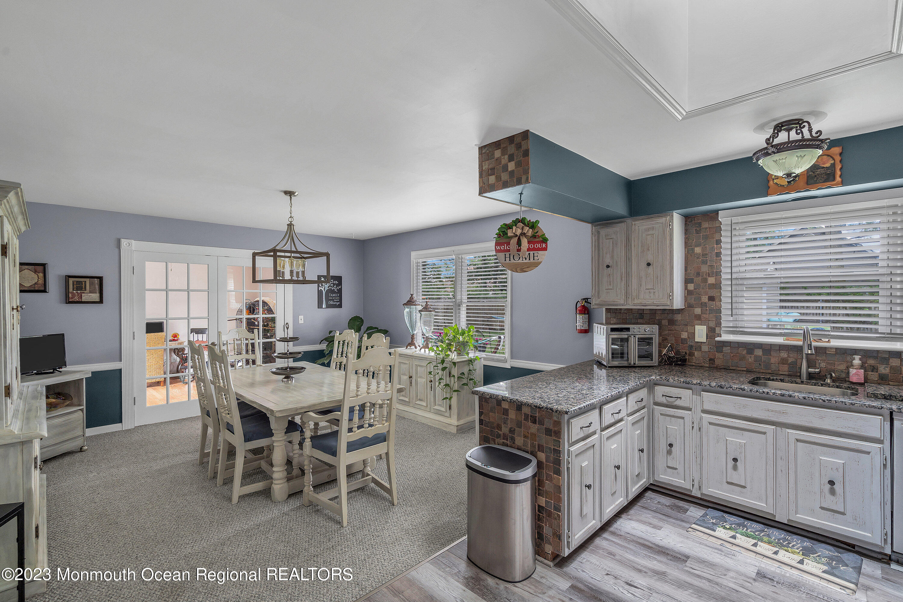 20 Woodland Road Bayville, NJ 08721 - Photo 29 of 62 a open kitchen with stainless steel appliances granite countertop a sink a stove and a refrigerator