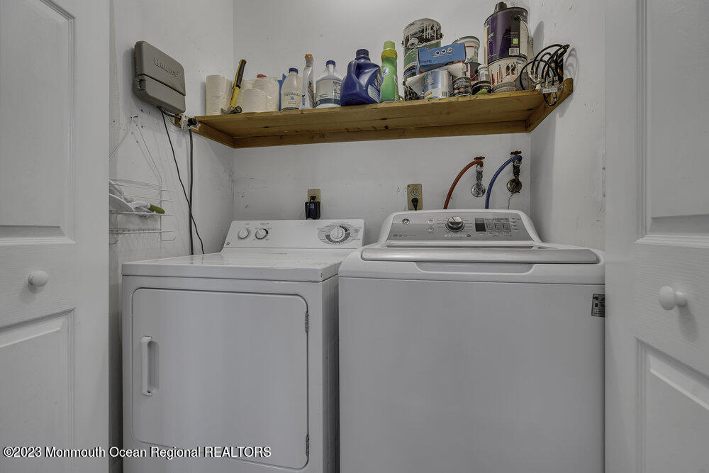 20 Woodland Road Bayville, NJ 08721 - Photo 36 of 62 a utility room with dryer and washer