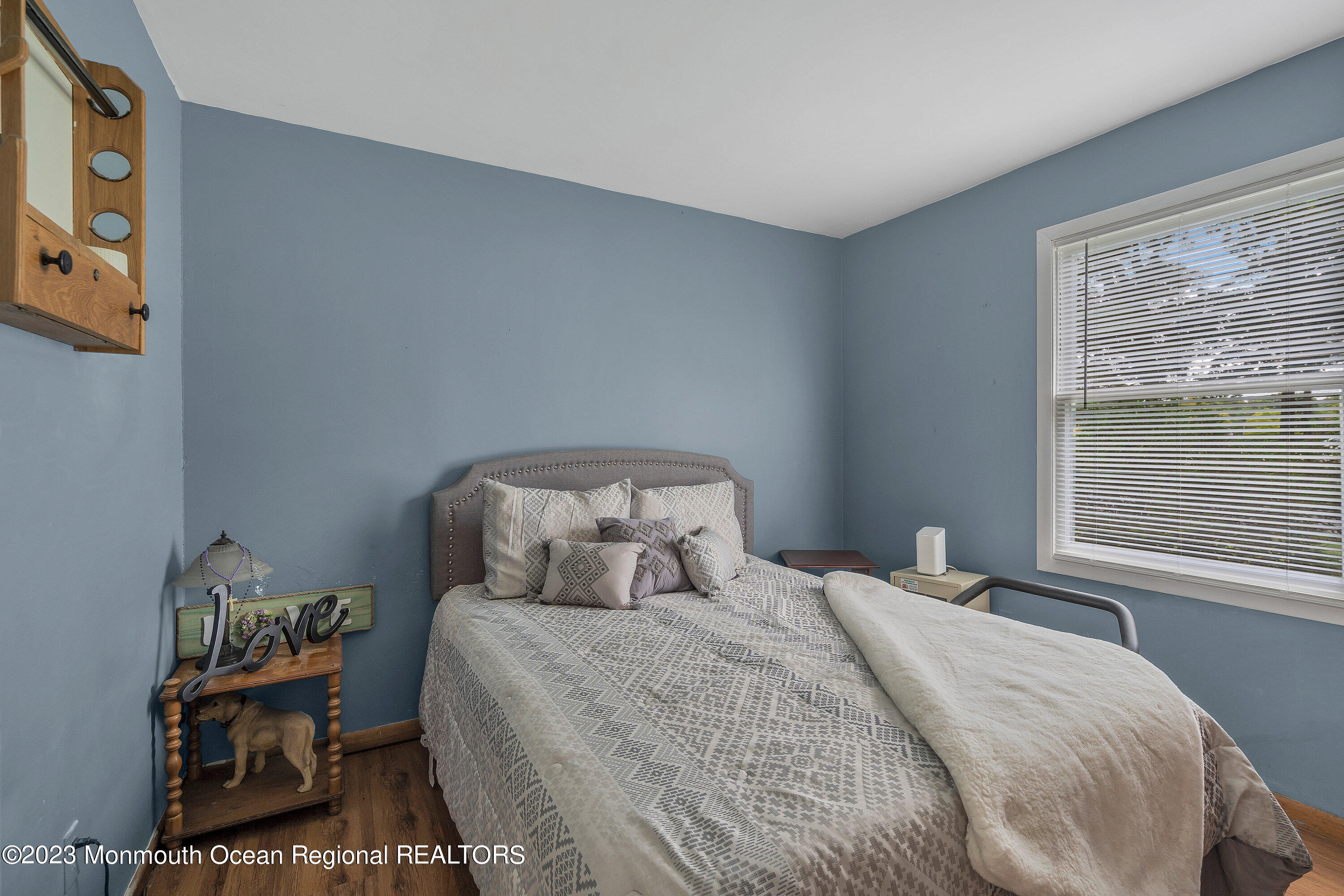 20 Woodland Road Bayville, NJ 08721 - Photo 47 of 62 a bedroom with a bed and a window