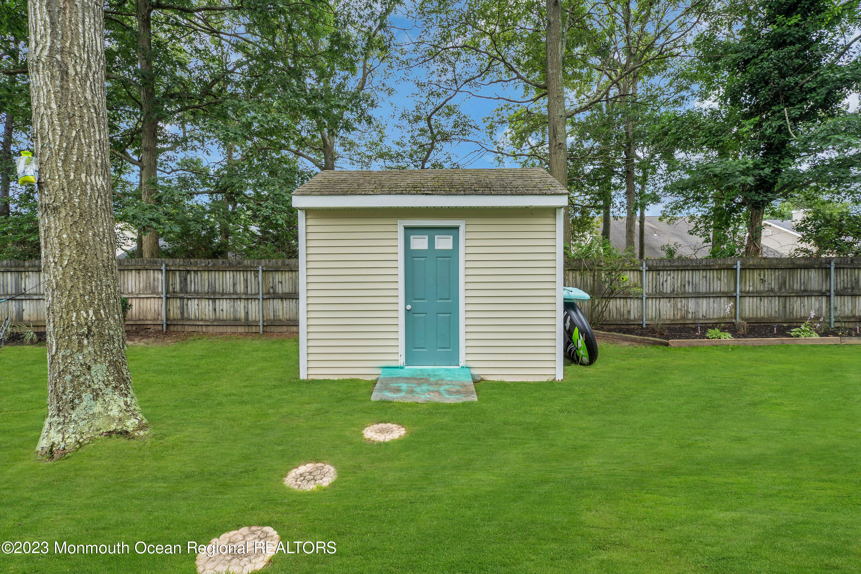 20 Woodland Road Bayville, NJ 08721 - Photo 50 of 62 a front view of a house with a yard