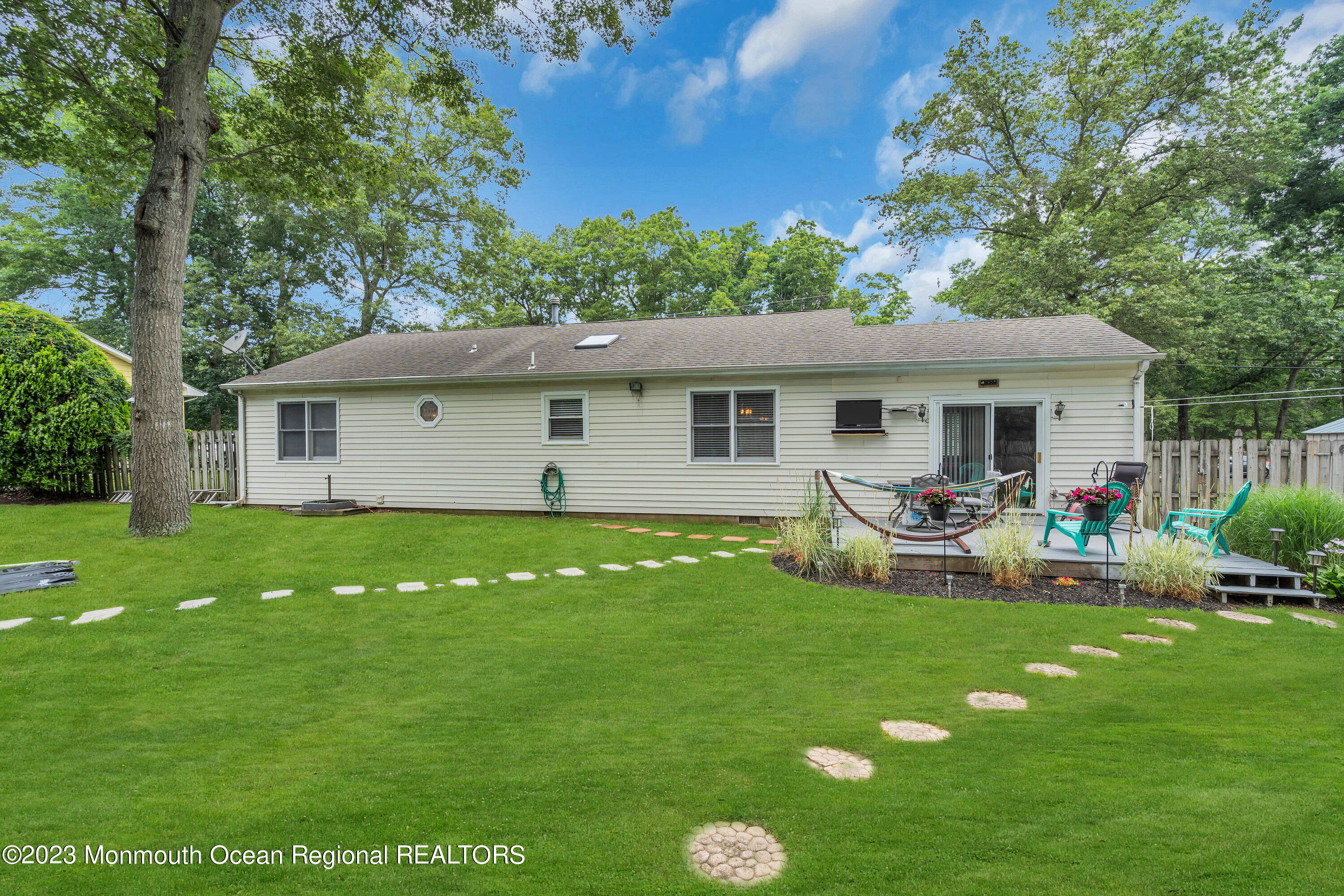 20 Woodland Road Bayville, NJ 08721 - Photo 51 of 62 a view of a house with a backyard and sitting area