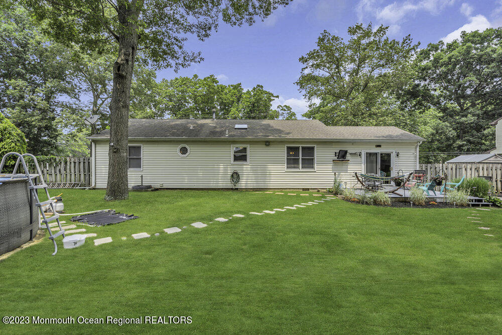 20 Woodland Road Bayville, NJ 08721 - Photo 52 of 62 a view of a house with a backyard