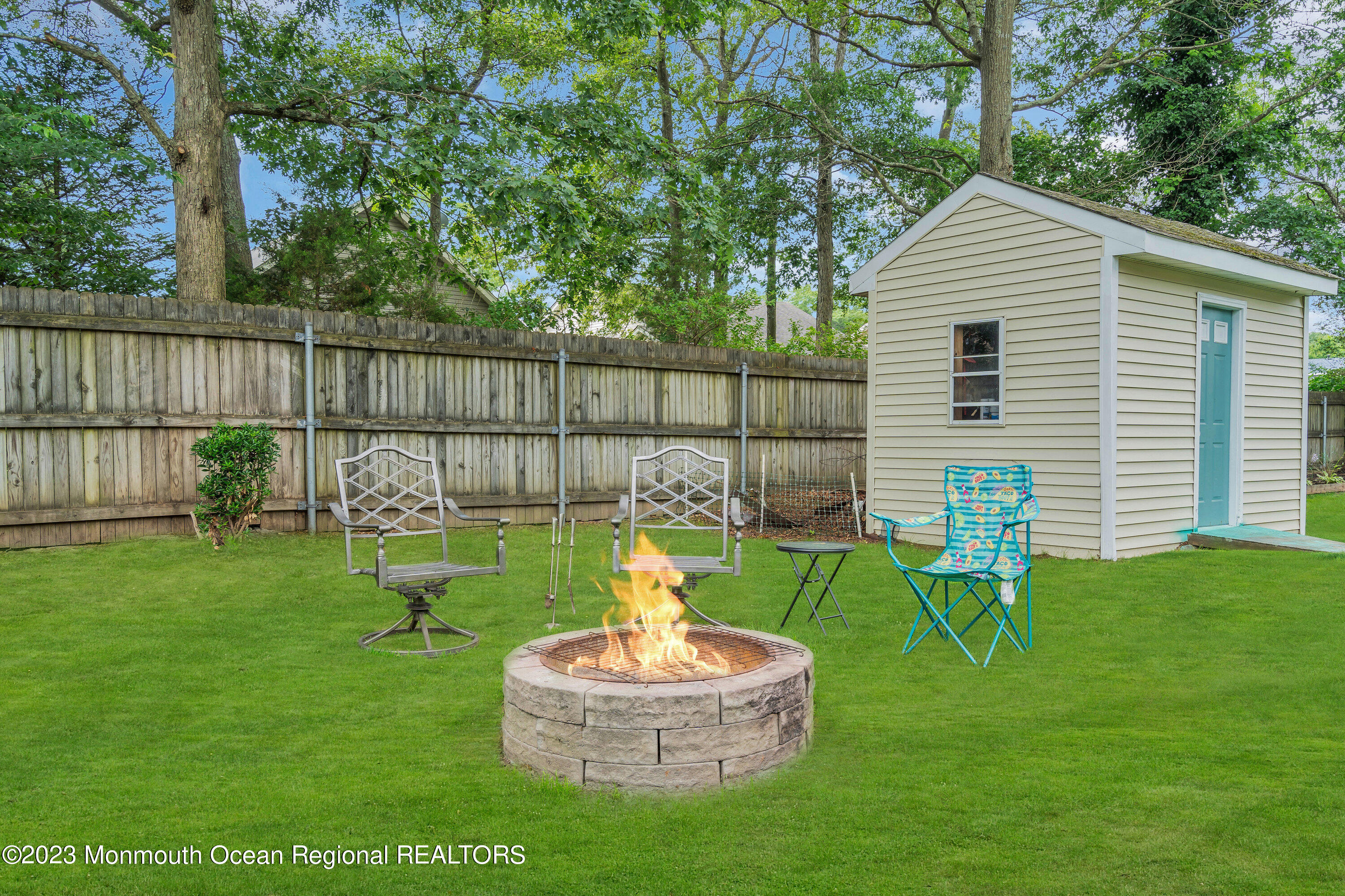 20 Woodland Road Bayville, NJ 08721 - Photo 59 of 62 a house view with a sitting space and garden