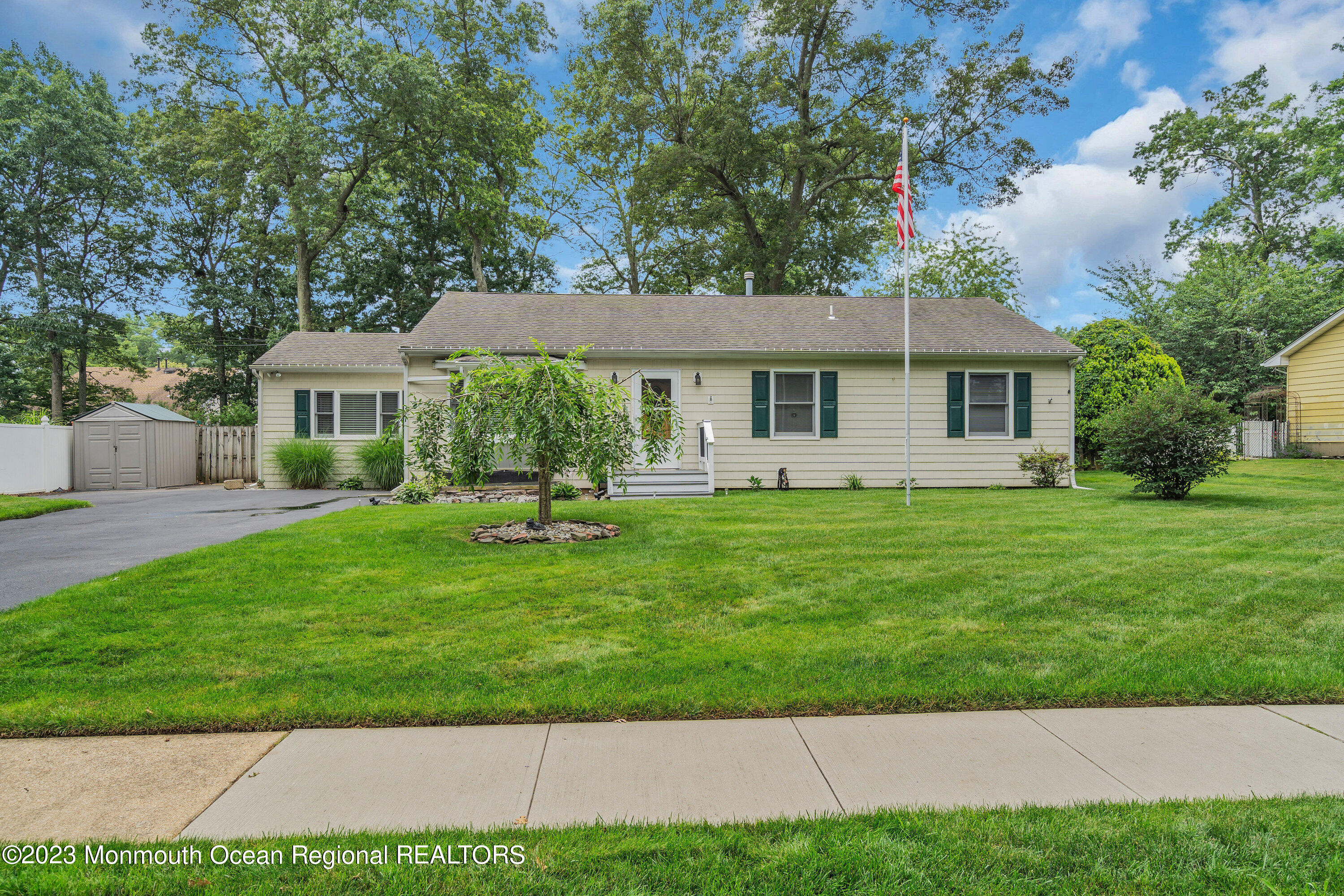 20 Woodland Road Bayville, NJ 08721 - Photo 6 of 62 a front view of house with yard and green space