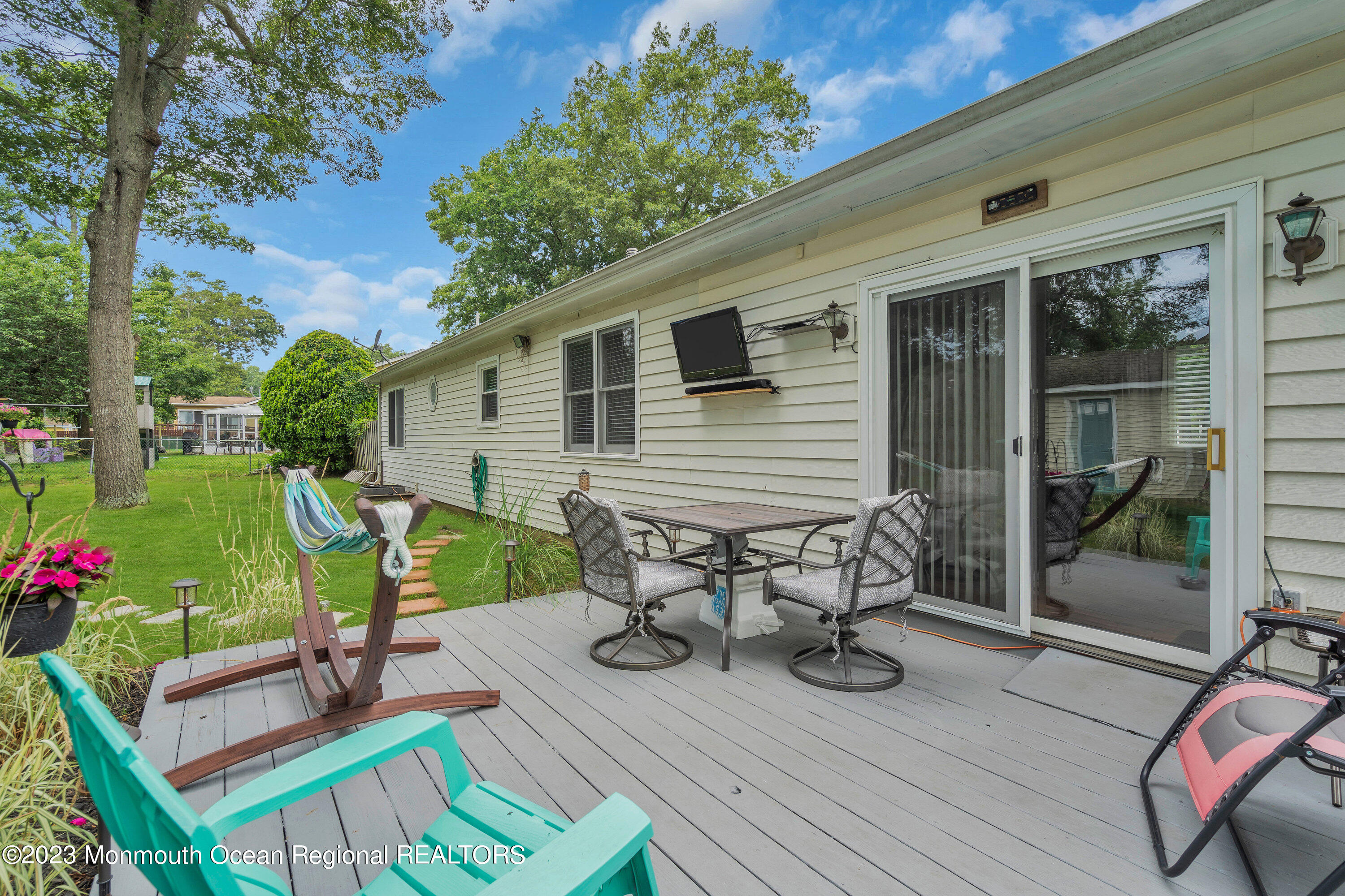 20 Woodland Road Bayville, NJ 08721 - Photo 62 of 62 a view of a chairs and table in patio of the house