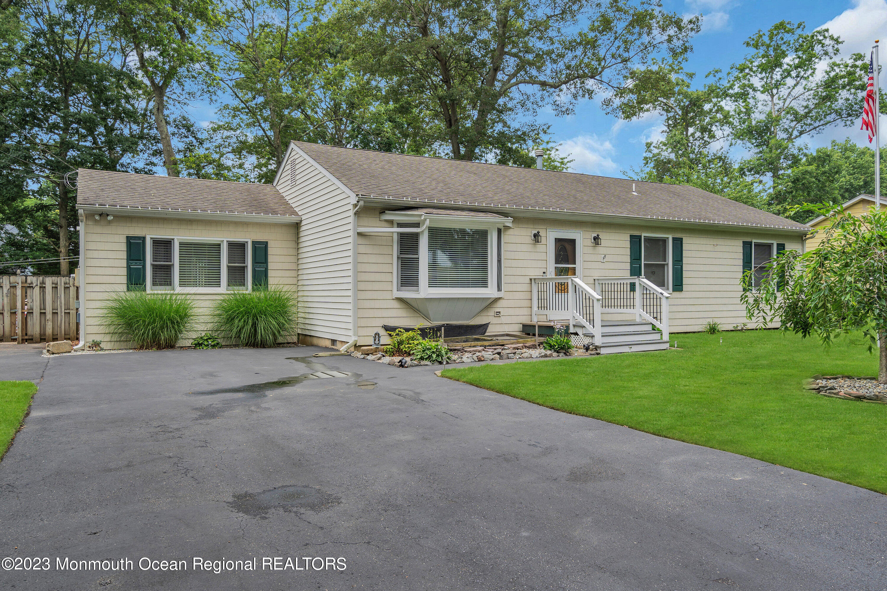 20 Woodland Road Bayville, NJ 08721 - Photo 8 of 62 a front view of house with yard and green space