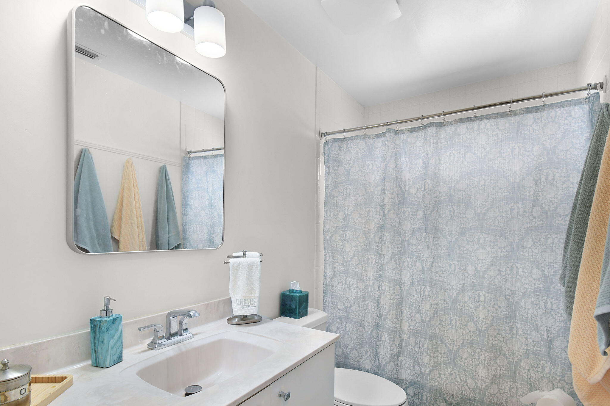5251 Southeast Sea Island Way Stuart, FL 34997 - Photo 25 of 68 a bathroom with a sink and a mirror