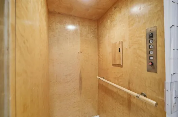 a view of a bathroom with a tub shower and a sink