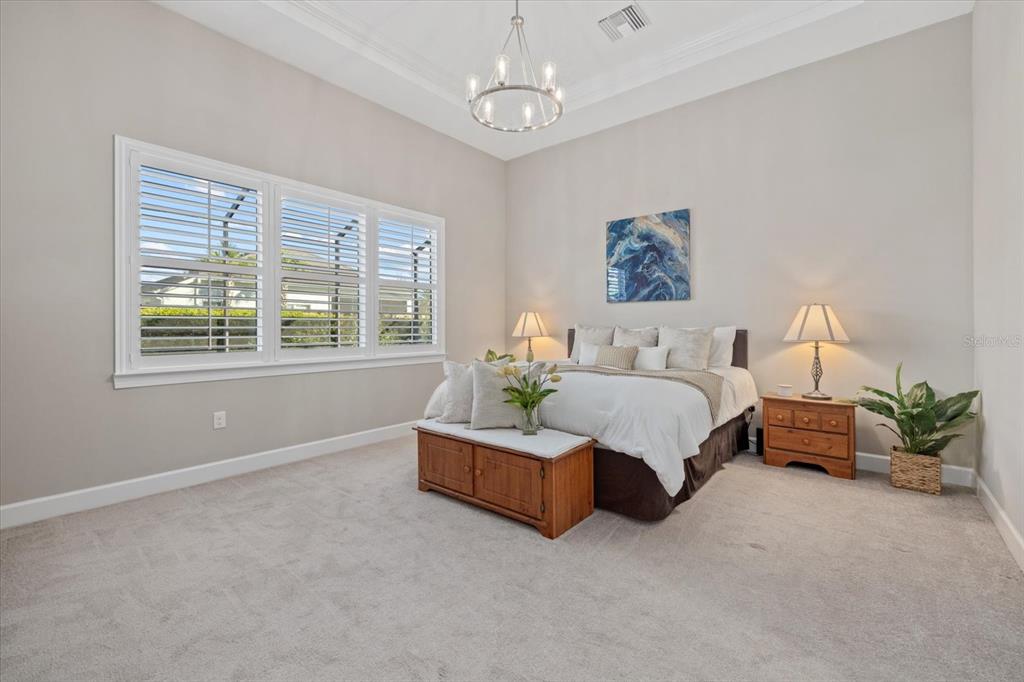 12423 Blue Hl Trail Lakewood Ranch, FL 34211 - Photo 22 of 74 a bedroom with bed and window