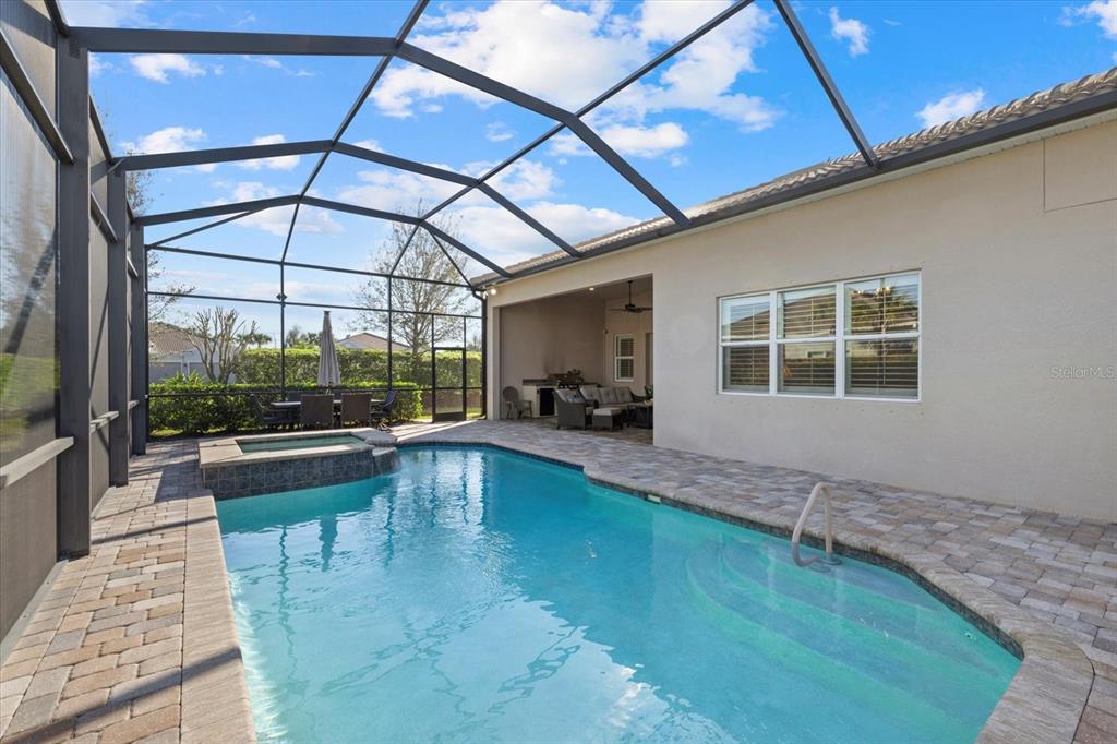 12423 Blue Hl Trail Lakewood Ranch, FL 34211 - Photo 42 of 74 a view of a swimming pool with a patio