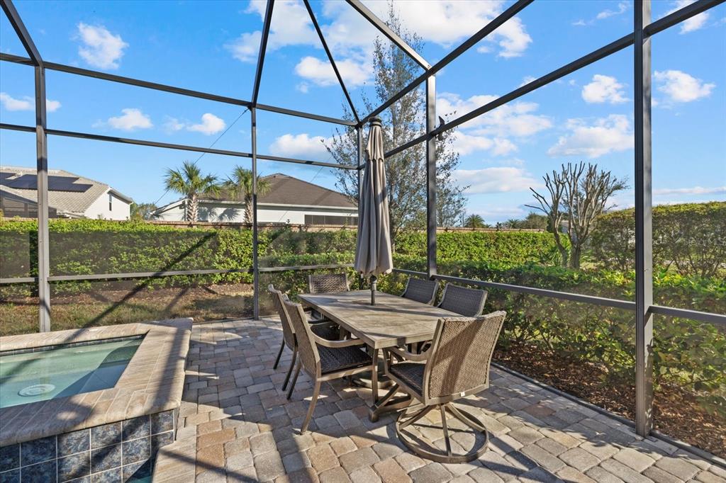 12423 Blue Hl Trail Lakewood Ranch, FL 34211 - Photo 43 of 74 a view of a patio with a table chairs and backyard