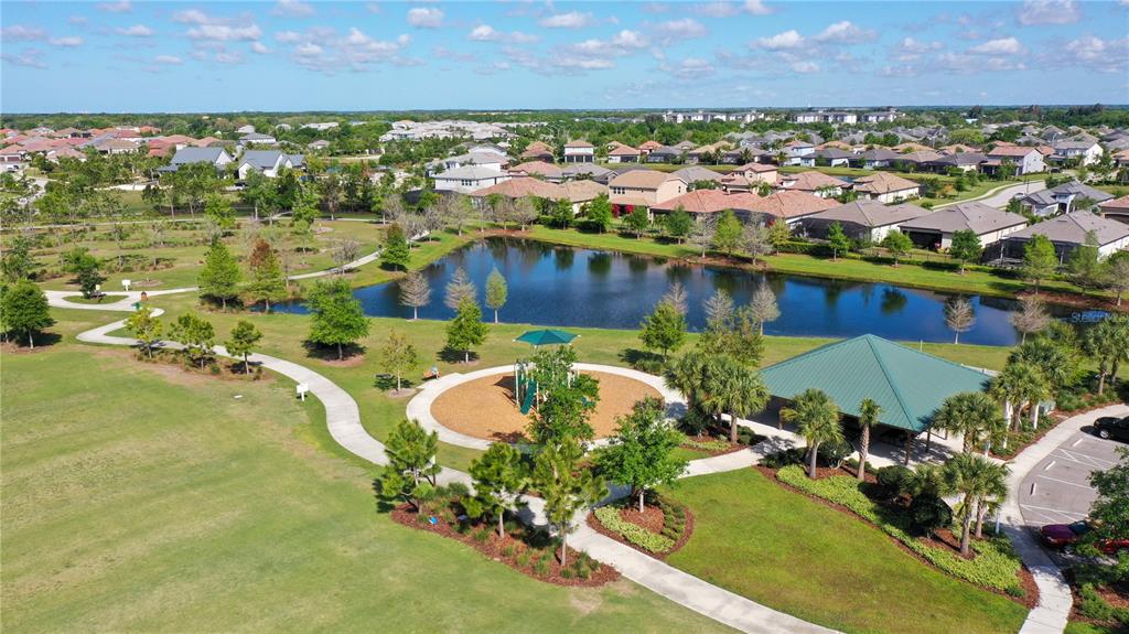 12423 Blue Hl Trail Lakewood Ranch, FL 34211 - Photo 67 of 74 an aerial view of residential houses with outdoor space and swimming pool