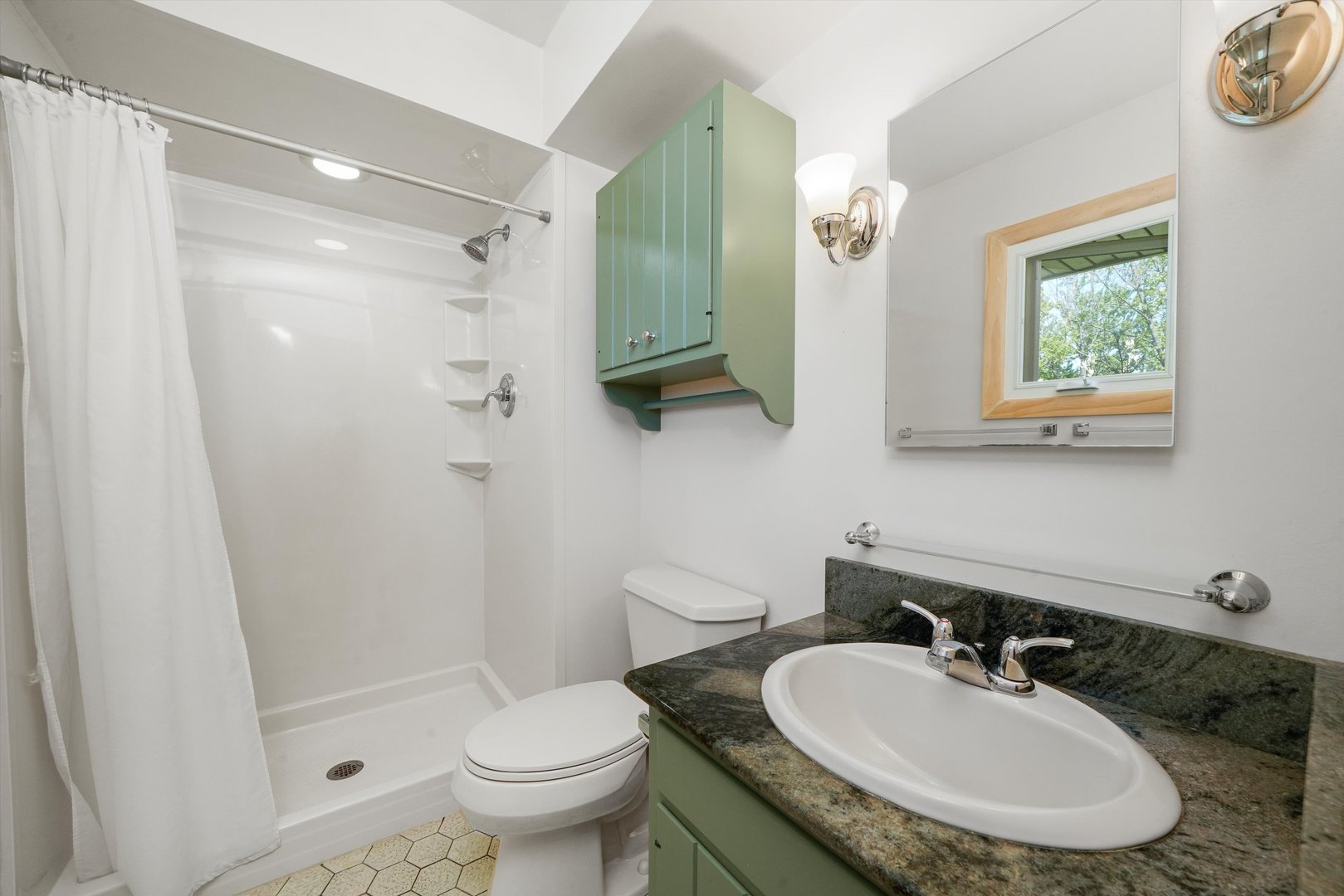 24350 Laura Lane Crete, IL 60417 - Photo 11 of 16 a bathroom with a sink toilet a mirror and shower