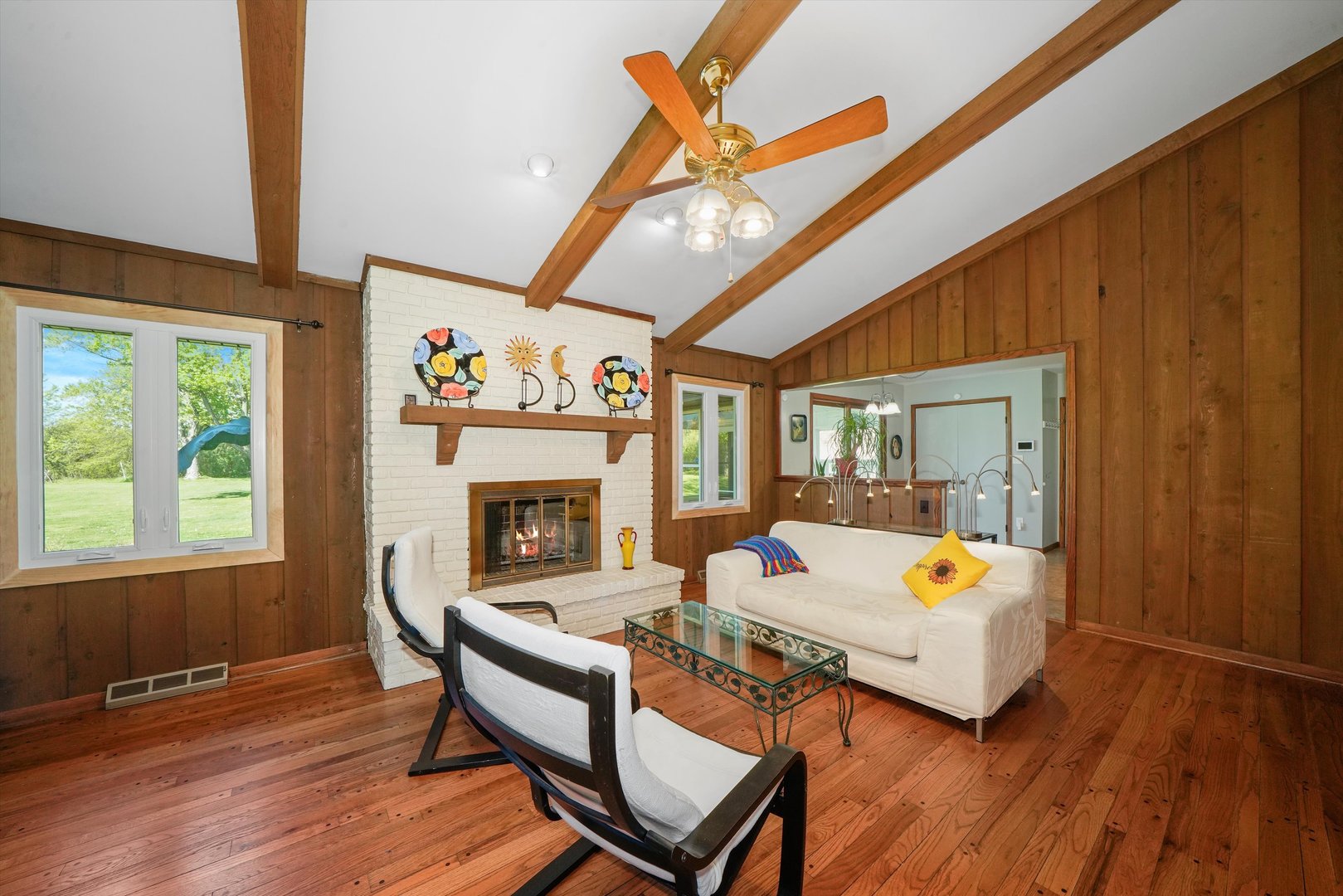 24350 Laura Lane Crete, IL 60417 - Photo 8 of 16 a living room with furniture a fireplace and wooden floor