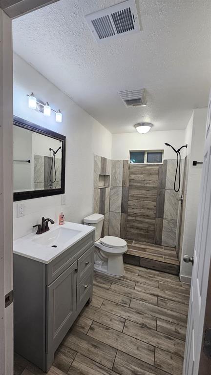 1007 Willow Street Bonham, TX 75418 - Photo 11 of 11 a bathroom with a sink toilet and shower