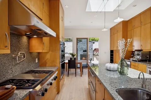 a kitchen with a stove and a sink