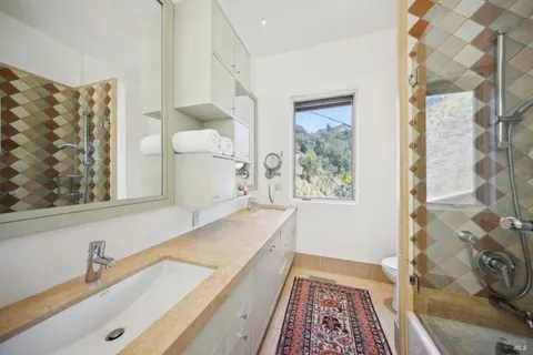 a bathroom with a bathtub and a shower