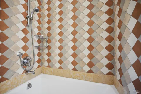 a bathroom with a bathtub and a shower curtain