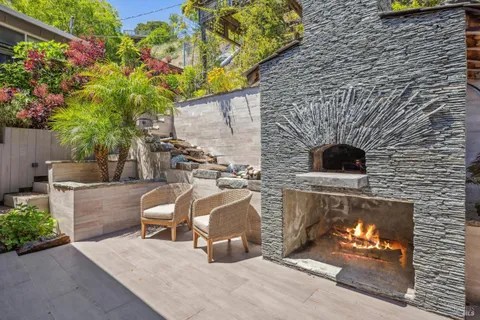 a living room with furniture and flowers