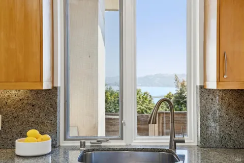 a view of living room with a couch and floor to ceiling window