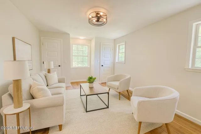 a living room with furniture and a window