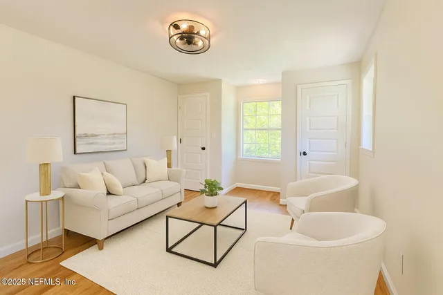 a living room with furniture and a window