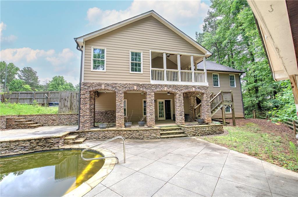 561 Holland Road Dallas, GA 30157 - Photo 45 of 48 a view of house with yard outdoor seating area and barbeque oven
