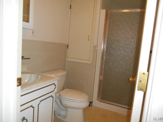 277 Henry Road Nazareth, PA 18064 - Photo 12 of 14 a bathroom with a granite countertop toilet and a sink