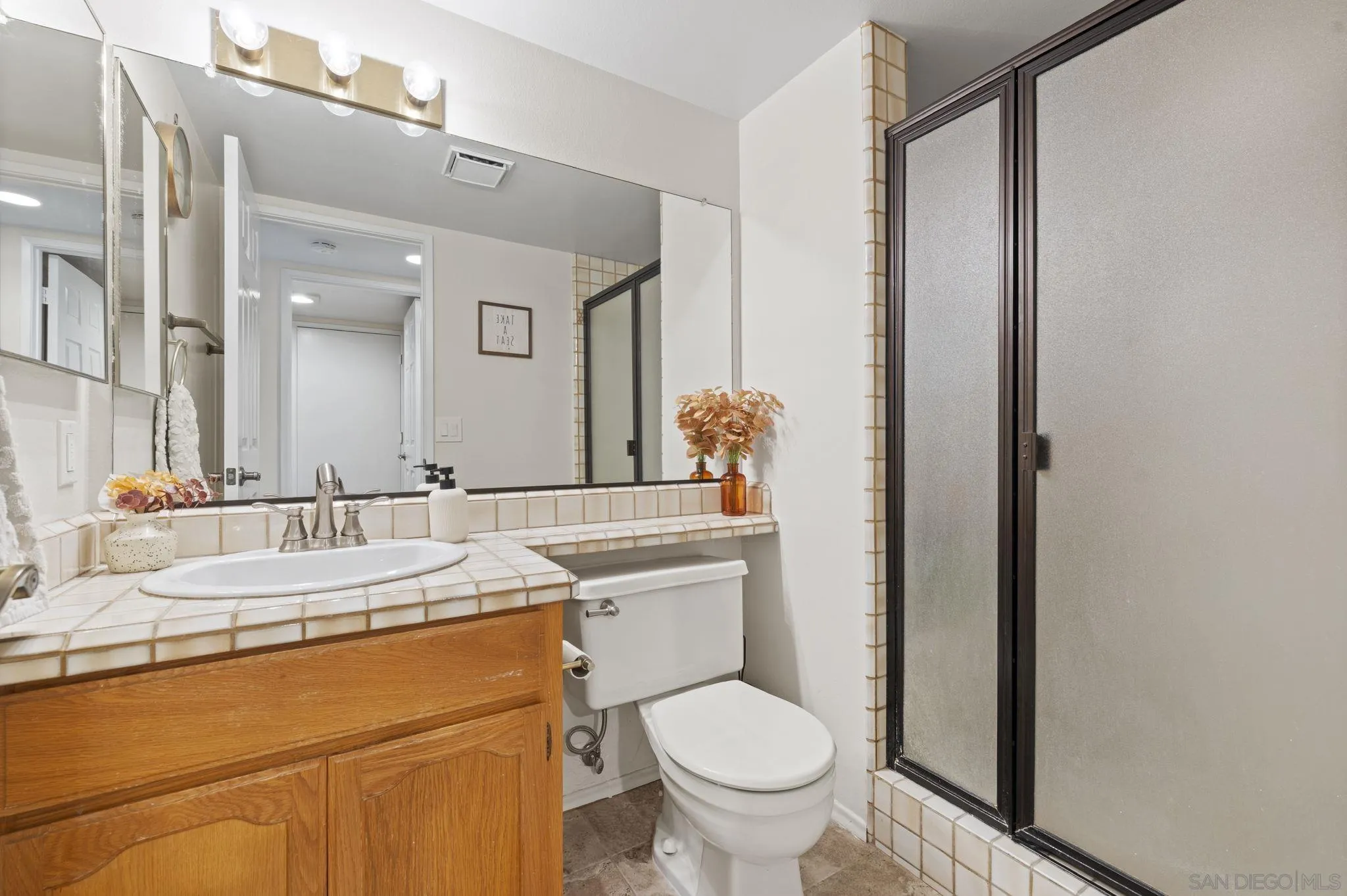 14725 Fieldview Way Poway, CA 92064 - Photo 12 of 67 a bathroom with a sink toilet and a mirror