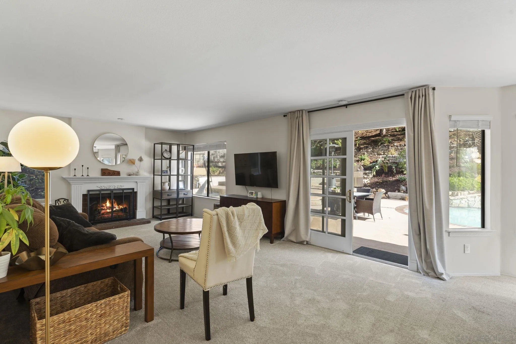 14725 Fieldview Way Poway, CA 92064 - Photo 15 of 67 a living room with furniture a fireplace and a flat screen tv