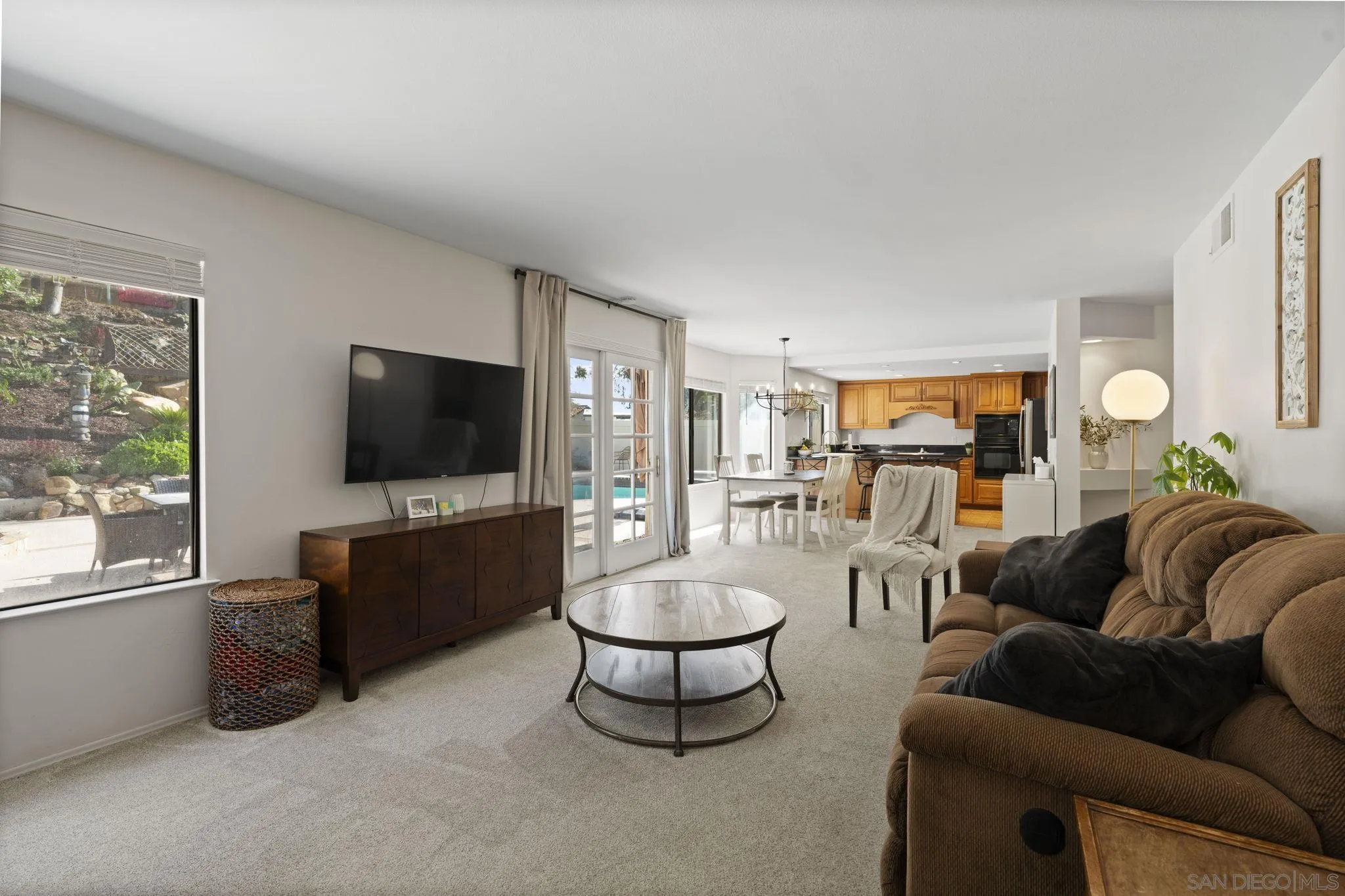 14725 Fieldview Way Poway, CA 92064 - Photo 17 of 67 a living room with furniture a flat screen tv and a large window