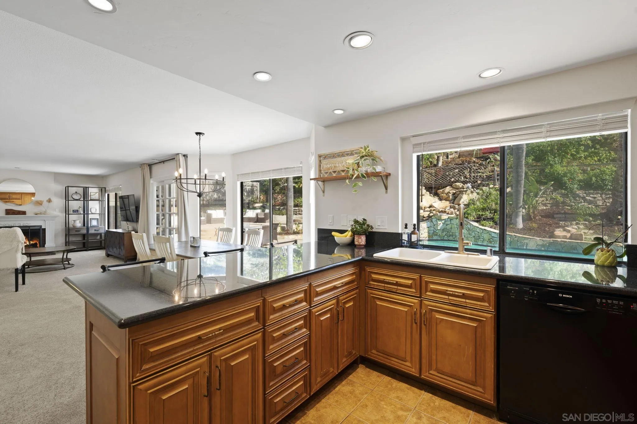 14725 Fieldview Way Poway, CA 92064 - Photo 22 of 67 a kitchen with stainless steel appliances granite countertop sink stove and large window