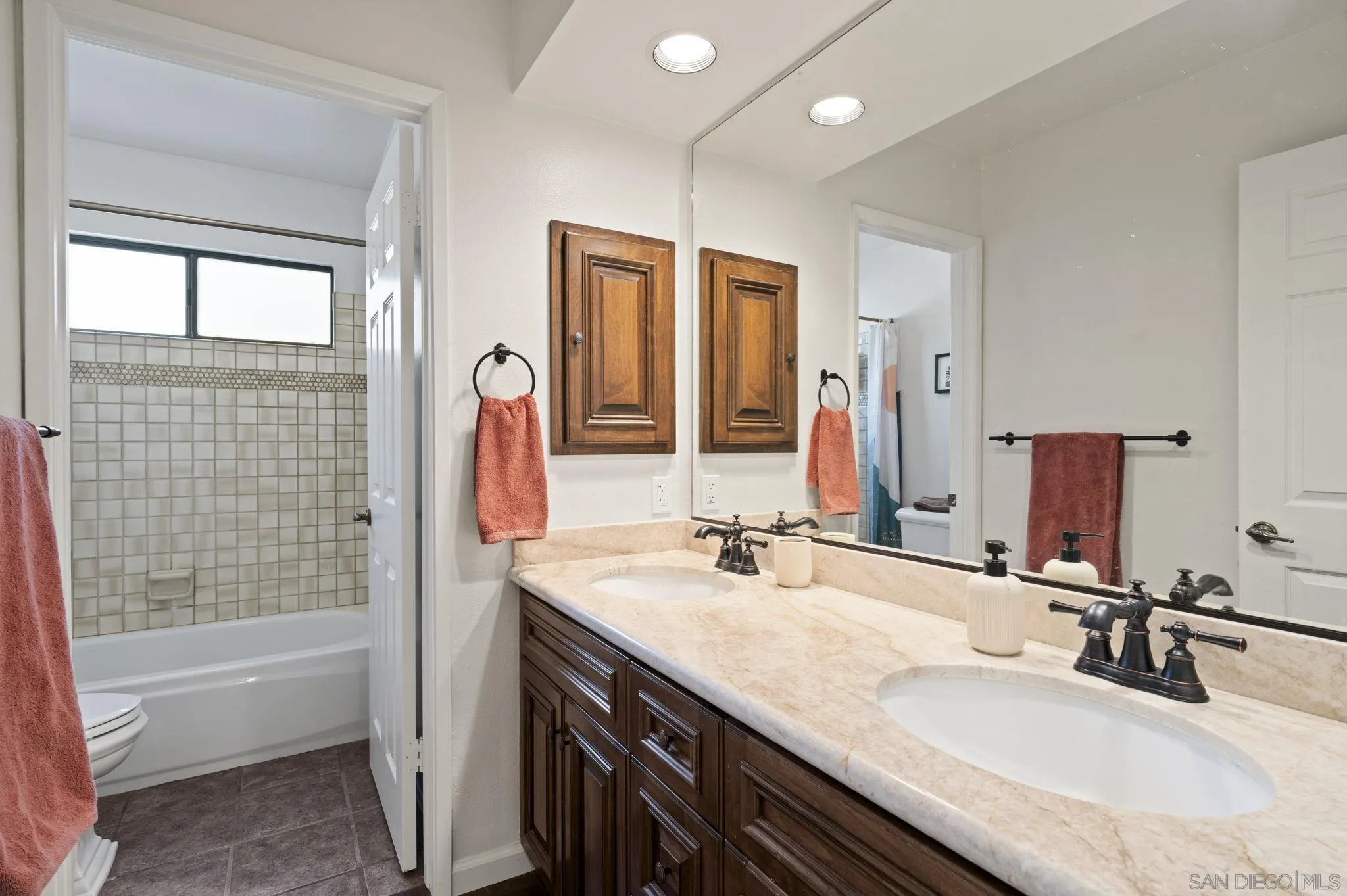 14725 Fieldview Way Poway, CA 92064 - Photo 30 of 67 a bathroom with a granite countertop sink and a mirror