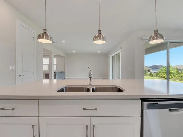 a kitchen with a sink and a window
