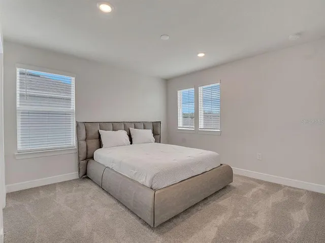 a room with a bed and a window