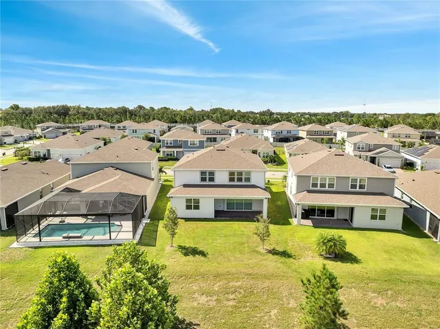 a view of residential houses with outdoor space