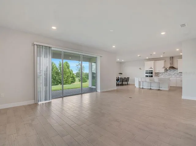 a view of kitchen with furniture and wooden floor