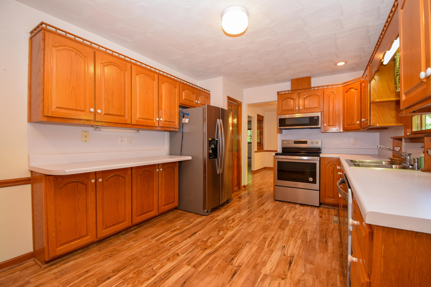 16415 Paint Bank Road Paint Bank, VA 24131 - Photo 11 of 36 a kitchen with stainless steel appliances a refrigerator sink and microwave