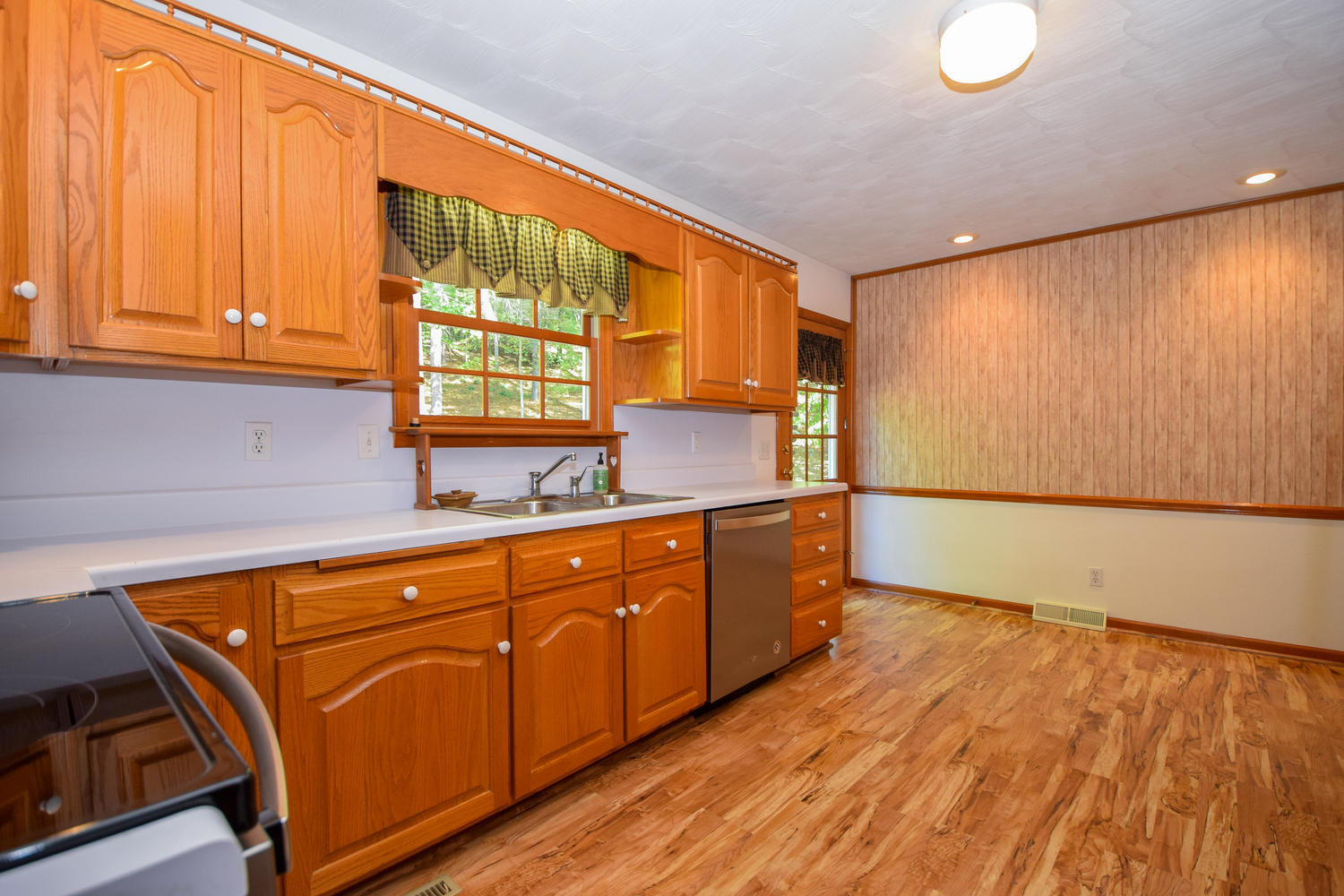 16415 Paint Bank Road Paint Bank, VA 24131 - Photo 12 of 36 a kitchen with stainless steel appliances wooden cabinets and a large window