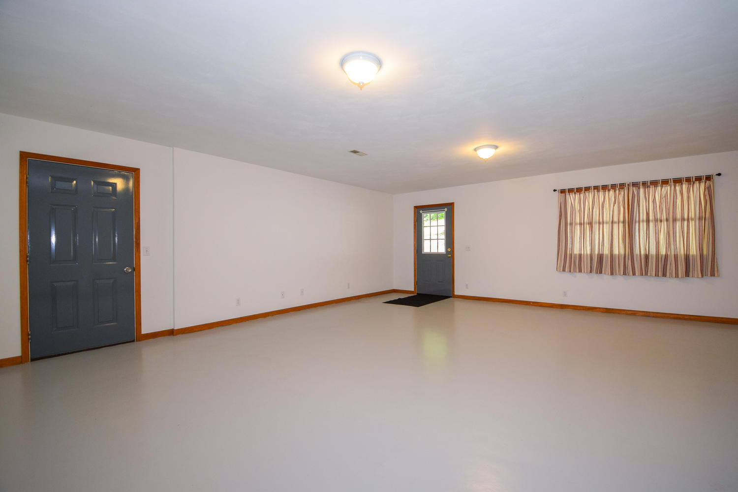 16415 Paint Bank Road Paint Bank, VA 24131 - Photo 20 of 36 an empty room with windows and view of kitchen