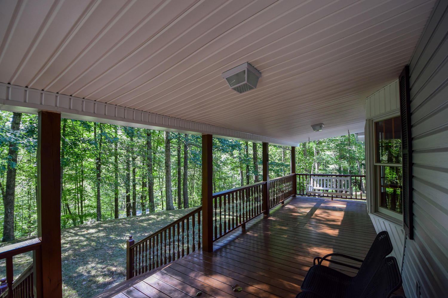 16415 Paint Bank Road Paint Bank, VA 24131 - Photo 3 of 36 a view of a balcony with floor to ceiling windows with wooden floor