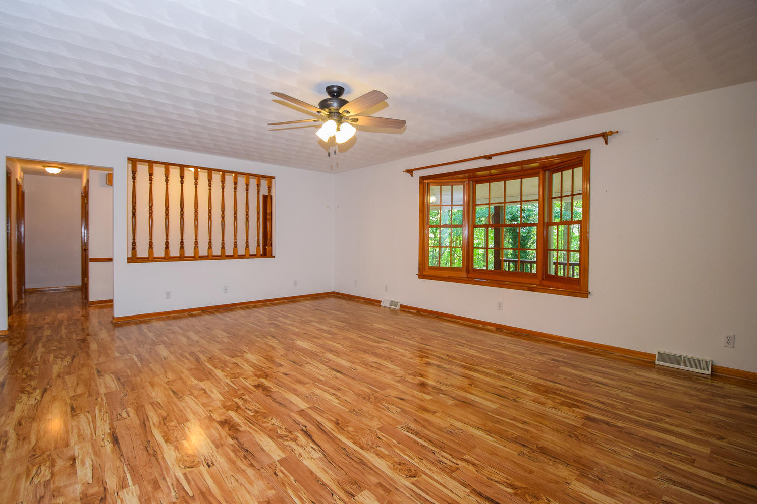 16415 Paint Bank Road Paint Bank, VA 24131 - Photo 5 of 36 a view of an empty room with a window and wooden floor