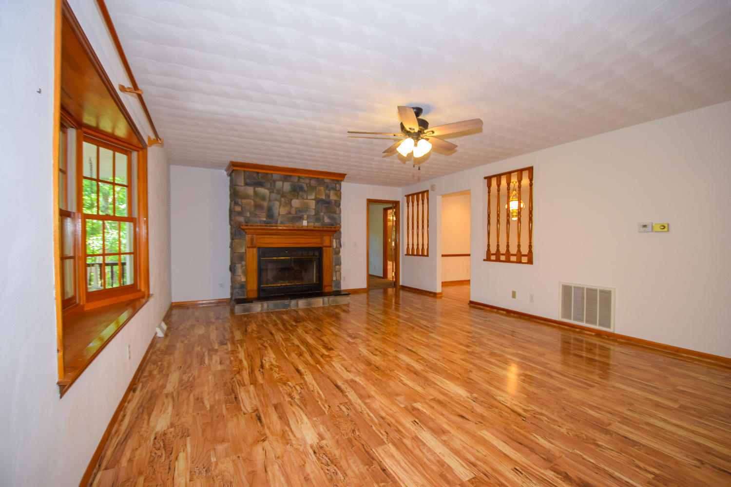 16415 Paint Bank Road Paint Bank, VA 24131 - Photo 7 of 36 a view of an empty room with a window and fireplace
