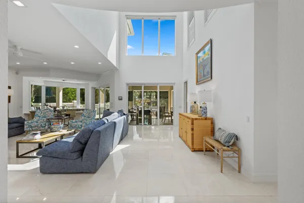 a kitchen with kitchen island granite countertop a sink a counter top space stainless steel appliances and cabinets