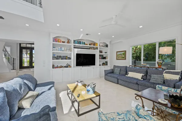 a bathroom with a sink a toilet and shower curtain