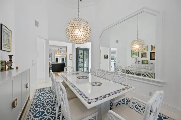 a bedroom with a bed and a tv on the dresser