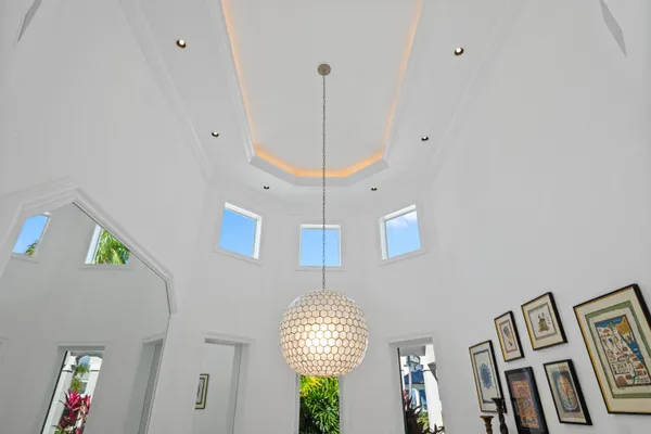 a bedroom with a bed and glass window