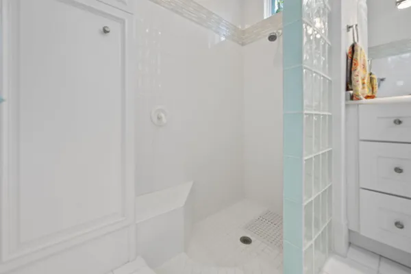 an aerial view of a house with garden space and street view